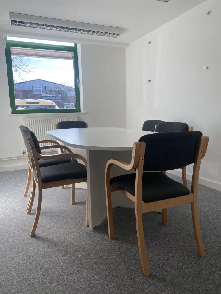 White table with black wooden chairs in Segment Office To Rent