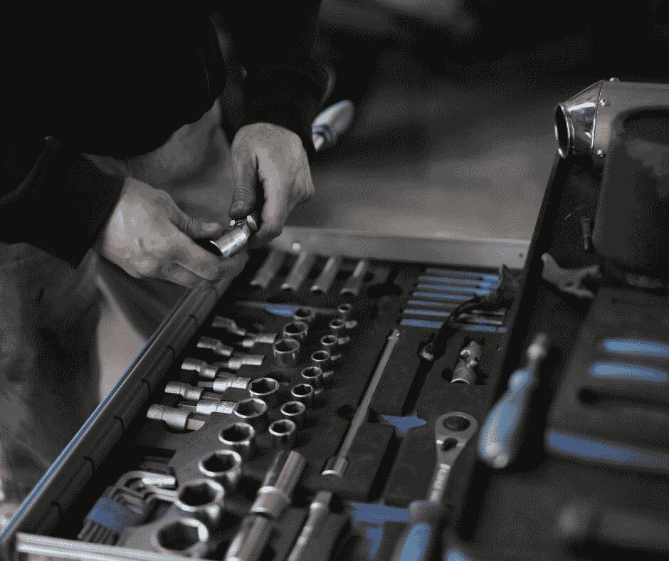 Man looking through toolbox