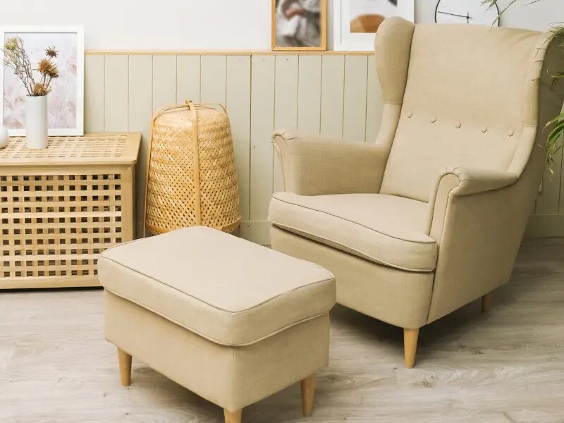 Cream arm chair with leg rest